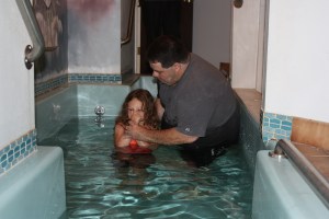Kendyl being baptized by her dad! <3